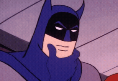 A Close Up Of A Cartoon Character Wearing A Blue Batman Costume . GIF