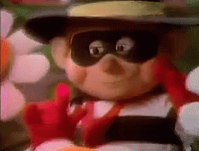 A Close Up Of A Cartoon Character Wearing A Hat And Mask . GIF