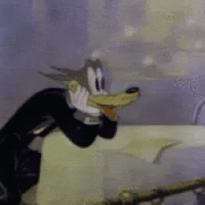 A Close Up Of A Cartoon Character Wearing A Tuxedo And A Hat . GIF
