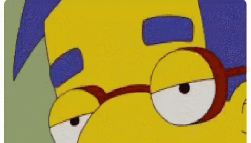 A Close Up Of A Cartoon Character Wearing Glasses And A Blue Haircut . GIF