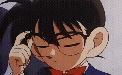 A Close Up Of A Cartoon Character Wearing Glasses And A Red Bow Tie . GIF