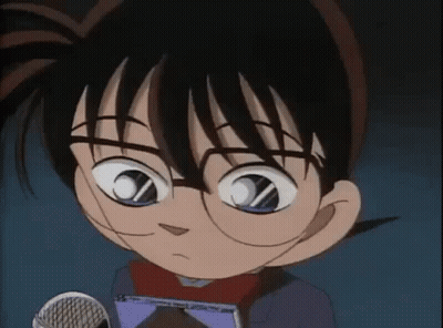 A Close Up Of A Cartoon Character Wearing Glasses Holding A Microphone . GIF