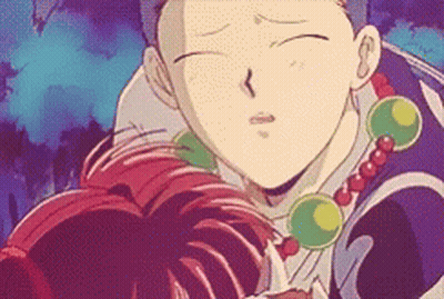 A Close Up Of A Cartoon Character With A Necklace Of Beads GIF