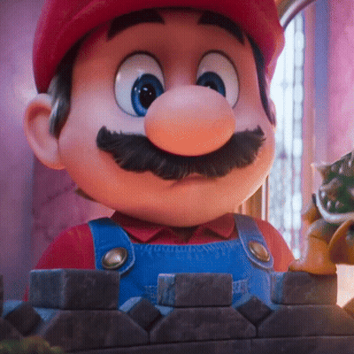 A Close Up Of A Cartoon Character With A Red Hat And Blue Overalls GIF