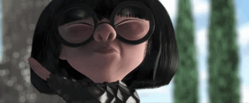 A Close Up Of A Cartoon Character With Glasses On GIF