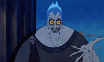 A Close Up Of A Cartoon Character With Glowing Eyes And A Skull On His Shoulder . GIF