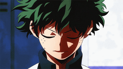 A Close Up Of A Cartoon Character With Green Hair GIF