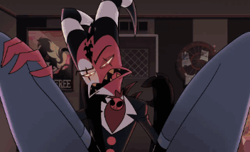 a close up of a cartoon character with horns holding a hose