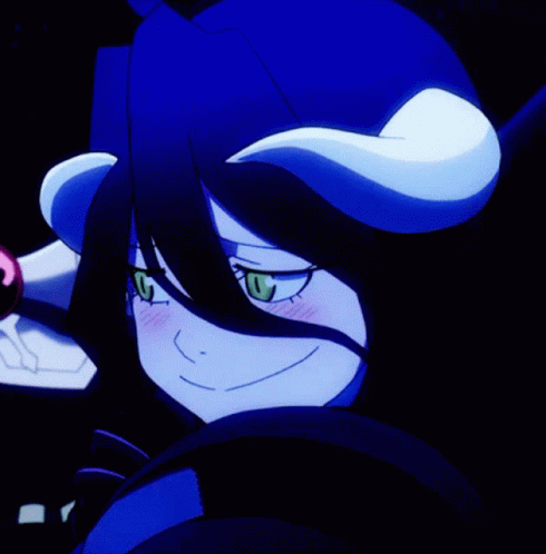A Close Up Of A Cartoon Character With Horns On Her Head GIF