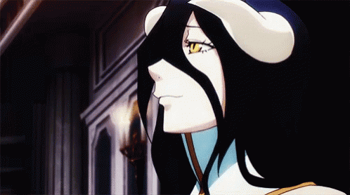 A Close Up Of A Cartoon Character With Horns On Her Head . GIF