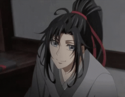A Close Up Of A Cartoon Character With Long Black Hair And A Ponytail GIF