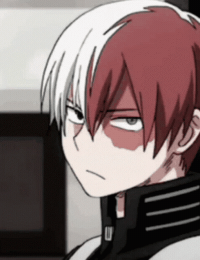 A Close Up Of A Cartoon Character With Red And White Hair GIF