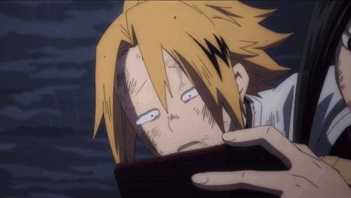 A Close Up Of A Cartoon Character With Yellow Hair Making A Funny Face GIF
