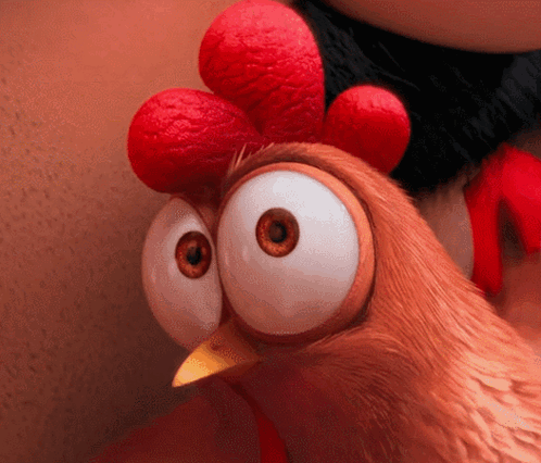 A Close Up Of A Cartoon Chicken With Big Eyes And A Red Crest GIF