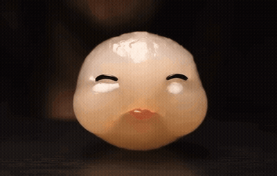A Close Up Of A Cartoon Face With A Red Mouth GIF