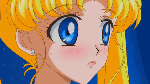 A Close Up Of A Cartoon Girl With Blue Eyes GIF