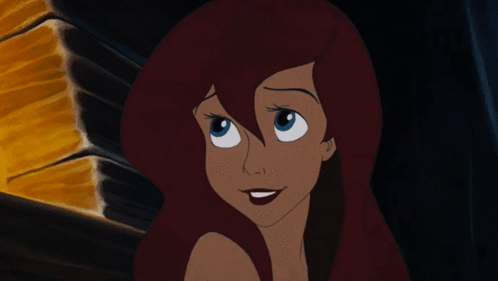 A Close Up Of A Cartoon Girl With Red Hair GIF