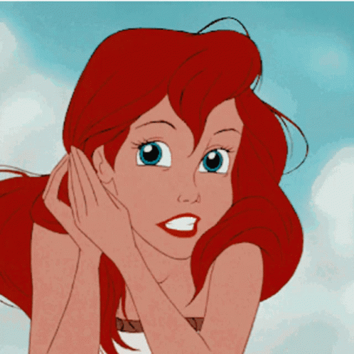 A Close Up Of A Cartoon Girl With Red Hair GIF