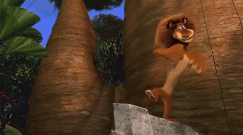A Close Up Of A Cartoon Lion With Its Mouth Wide Open GIF