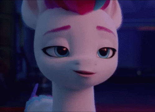 A Close Up Of A Cartoon Pony 'S Face With Blue Eyes GIF