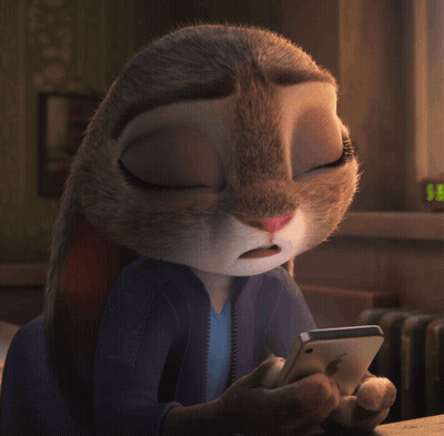 A Close Up Of A Cartoon Rabbit Holding A Phone GIF