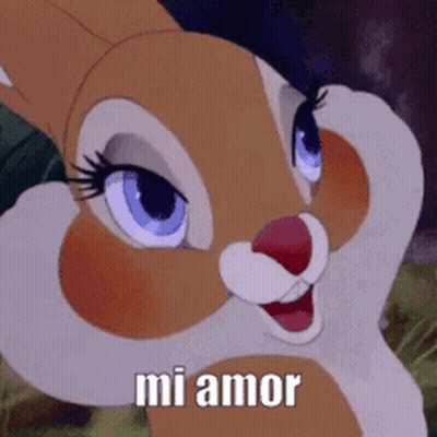 A Close Up Of A Cartoon Rabbit With The Words `` Mi Amor '' On It . GIF