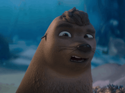 A Close Up Of A Cartoon Seal With A Wig On Its Head GIF