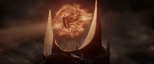 A Close Up Of A Castle With A Burning Eye In The Middle Of It . GIF