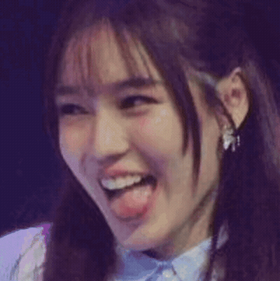 A Close Up Of A Cat 'S Face With Its Tongue Out GIF