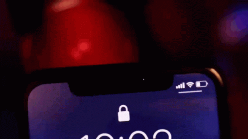 A Close Up Of A Cell Phone Displaying The Time As 10:02 GIF