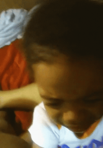 A Close Up Of A Child 'S Face With A Blue Shirt On That Says ' Nba ' On It GIF