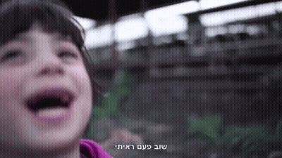 A Close Up Of A Child 'S Face With A Foreign Language Written On The Bottom GIF