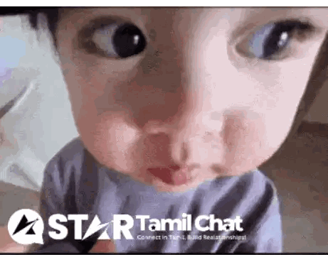 A Close Up Of A Child 'S Face With A Star Tamil Chat Logo In The Corner Sticker