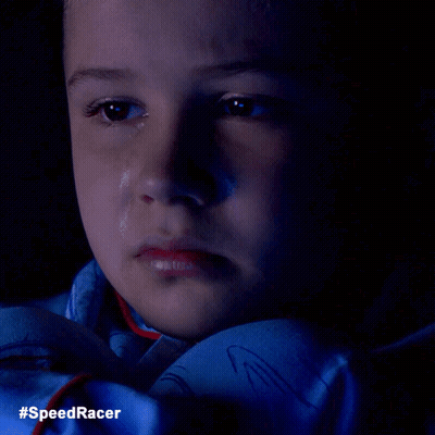A Close Up Of A Child 'S Face With A Tear Coming Out Of His Eye And The Words #Speedracer On The Bottom GIF