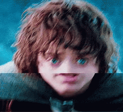 A Close Up Of A Child 'S Face With Blue Eyes GIF