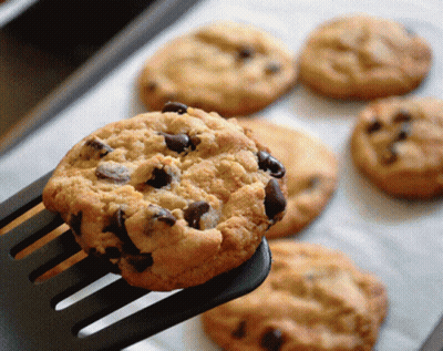 A Close Up Of A Chocolate Chip Cookie On A Fork GIF