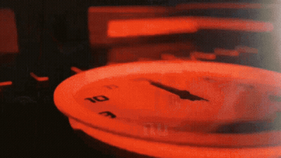 A Close Up Of A Clock With The Hands On The Numbers 1 And 10 GIF