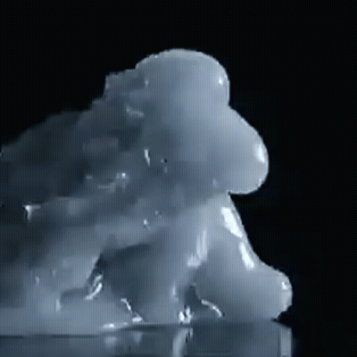 a close up of a cloud of liquid on a black background
