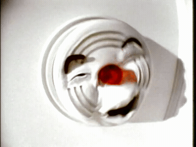 A Close Up Of A Clown 'S Face On A White Background GIF