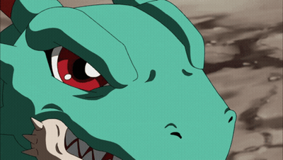 A Close Up Of A Dinosaur 'S Face With Red Eyes And Sharp Teeth GIF