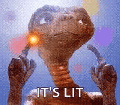 A Close Up Of A Dinosaur With A Light Coming Out Of It 'S Ear . GIF