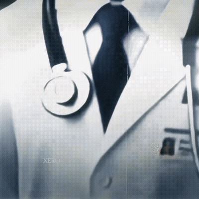 A Close Up Of A Doctor With A Stethoscope On His Jacket GIF