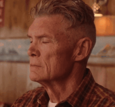 A Close Up Of A Dog 'S Face With His Eyes Closed GIF