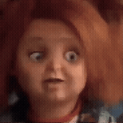 A Close Up Of A Doll 'S Face With A Surprised Look On Her Face . GIF
