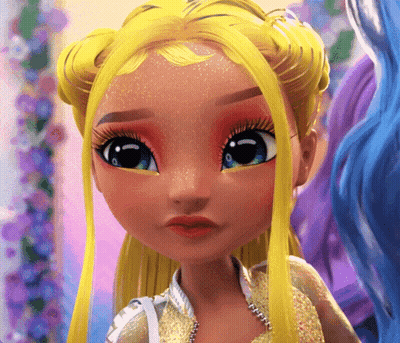 A Close Up Of A Doll 'S Face With Yellow Hair GIF