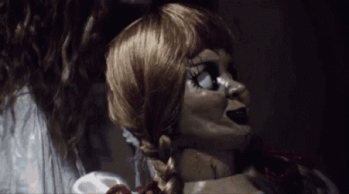 A Close Up Of A Doll With A Braided Hair GIF
