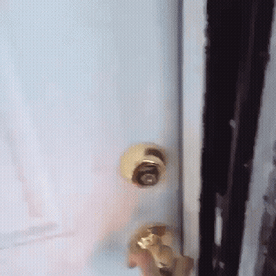 A Close Up Of A Door With A Gold Knob That Says ' O ' On It GIF