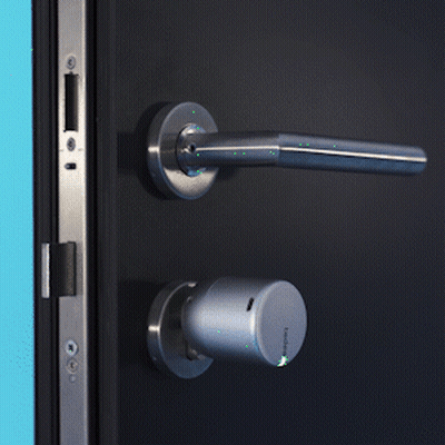 A Close Up Of A Door With A Handle And A Key GIF