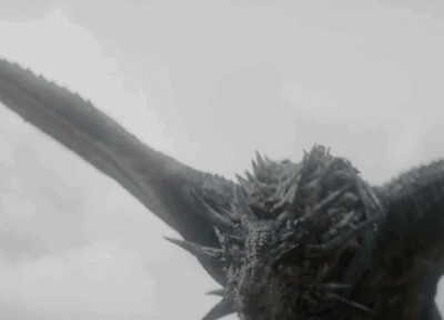 A Close Up Of A Dragon Flying In The Air . GIF