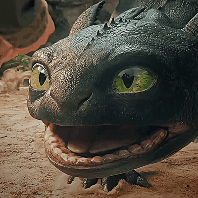 A Close Up Of A Dragon 'S Face With Its Mouth Wide Open GIF